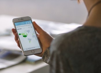 Woman looking at map on mobile phone